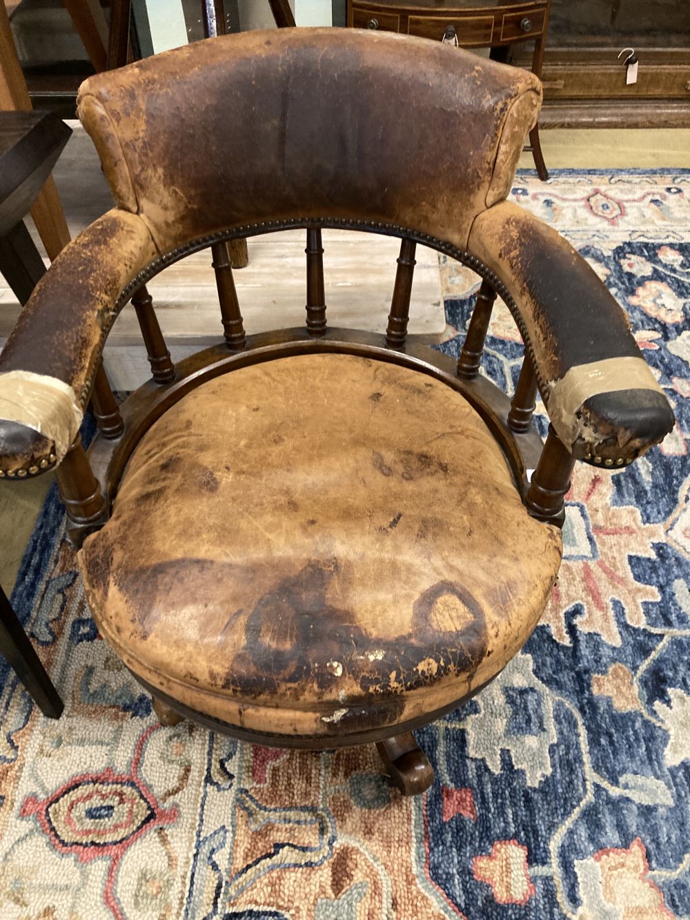 A Victorian leather upholstered mahogany swivel desk chair